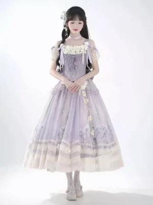 Lavender floral ball gown Lolita dress with off-shoulder puff sleeves, white floral bust embellishment, and delicate beige lace hem trim on studio background