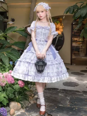 Lavender sweet lolita one-piece dress with tiered ruffled skirt floral print short puff sleeves front full body view outdoor garden