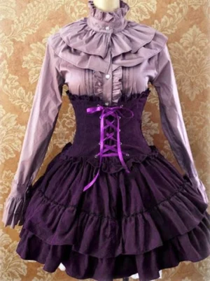 Lavender Gothic Lolita skirt set with lace-up corset waist and layered ruffled skirt styled on mannequin against damask wallpaper background