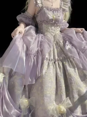 Close-up of lavender lolita dress upper body showing corset waist, ruffled shoulder straps, and purple jacquard fabric texture detail