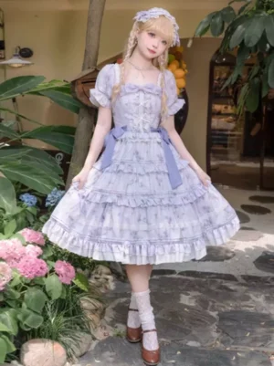 Lavender lolita dress three quarter front view with waist bow square neckline stone pathway outdoor setting