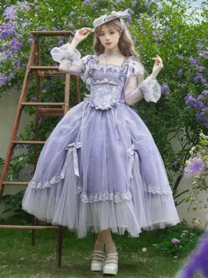 Full lavender Victorian lolita dress ensemble with sheer mesh sleeves square neckline layered tulle skirt garden setting wisteria backdrop