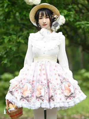 Light apricot sweet lolita skirt front full-body view with polka dot squirrel print and lace ruffles, model wearing straw hat in outdoor garden setting