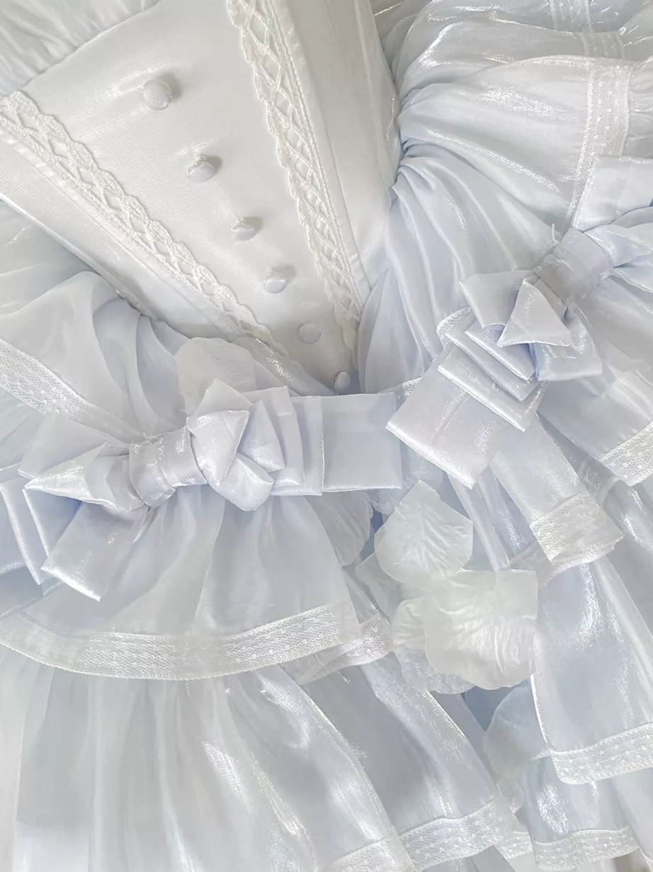 Celestial light blue fairy lolita dress showcasing removable oversleeves, structured corset design, layered ruffles, and versatile styling options