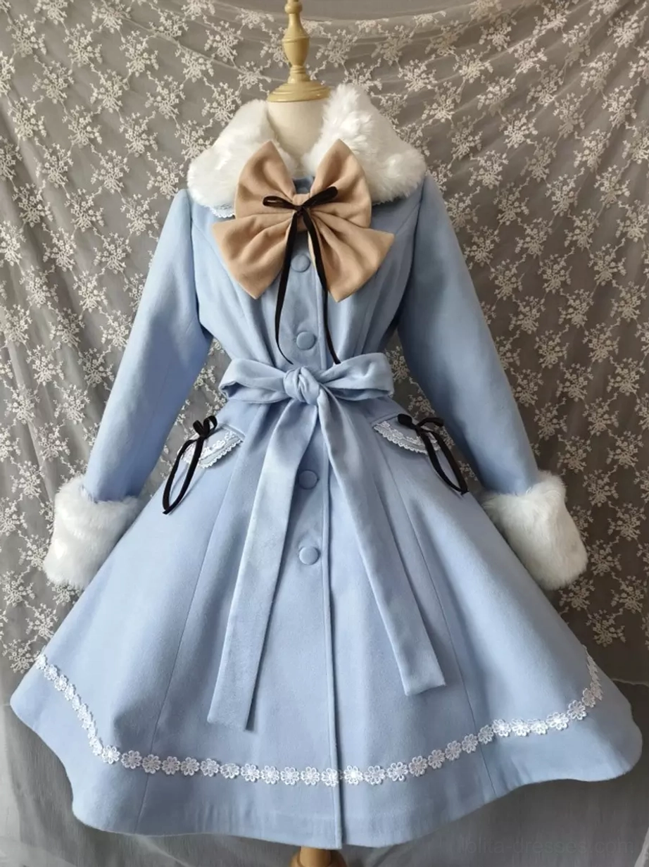 Light blue lolita winter coat front view with white fur collar and cuffs, beige bow accent, and lace hem trim displayed on dress form