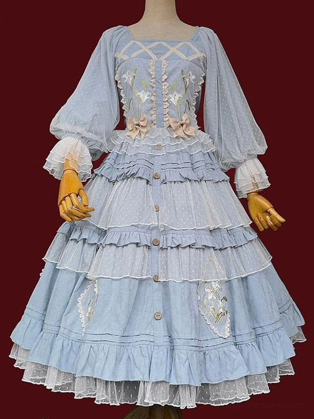 Light blue Classic Lolita dress front view on dress form with square neckline sheer puff sleeves bodice floral embroidery and layered ruffled skirt