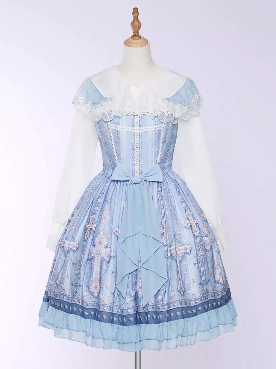 Light blue lolita dress full front display view on mannequin featuring sheer lace long sleeve overlay, cross printed skirt, ruffled hem detail, square neckline, and fitted waist on plain studio background