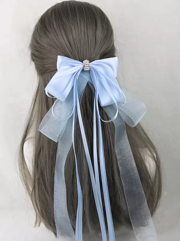 Light blue satin bow hair clip with rhinestone center buckle and two-type long ribbon streamers, lolita headwear displayed on mannequin