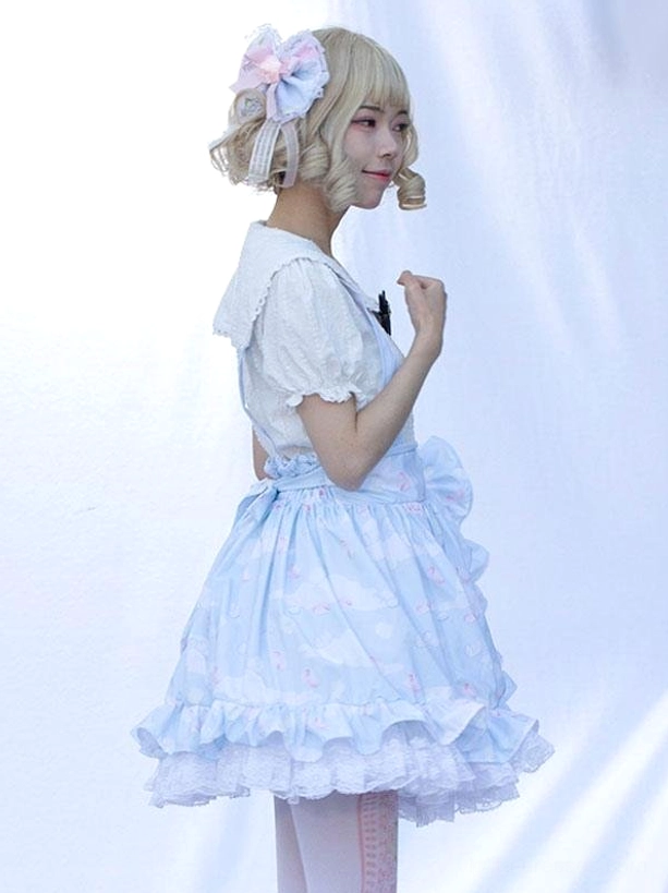 Three-quarter side angle light sky blue lolita skirt showcasing side ruffled details, short puff sleeves, floral printed fabric, high-waisted silhouette pastoral style