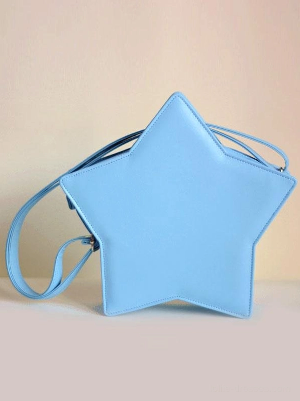 Light blue star-shaped lolita crossbody bag front eye-level shot with adjustable shoulder strap and matte leather finish displayed on gradient warm background