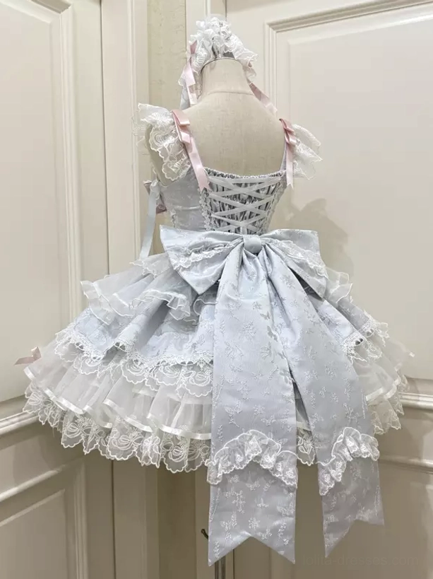Light blue sweet lolita dress rear back view large bow crisscross straps lace hem detail