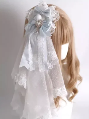 Light blue and white lolita headdress with lace veil gem pendant hair clip shown on blonde mannequin displaying delicate satin bows and sheer dotted veil detail from side back angle
