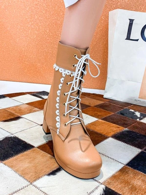 Light tan brown lace-up Lolita ankle boots with round toe and block heel featuring white decorative floral lace trim with shopping bag
