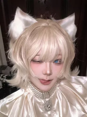 Ouji style lolita wig light gold blonde cat ears on winking cosplayer model with pearl choker set and messy short bob texture detail view