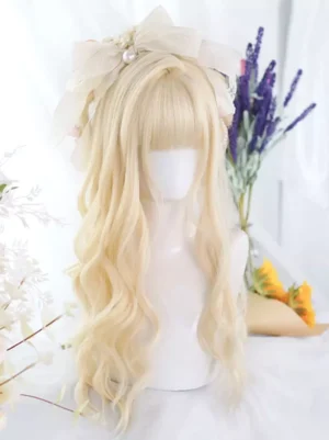 Light gold long wavy Lolita synthetic wig front view with delicate air bangs, styled with beige bow and pearl hair accessories, showing natural wavy texture against floral backdrop