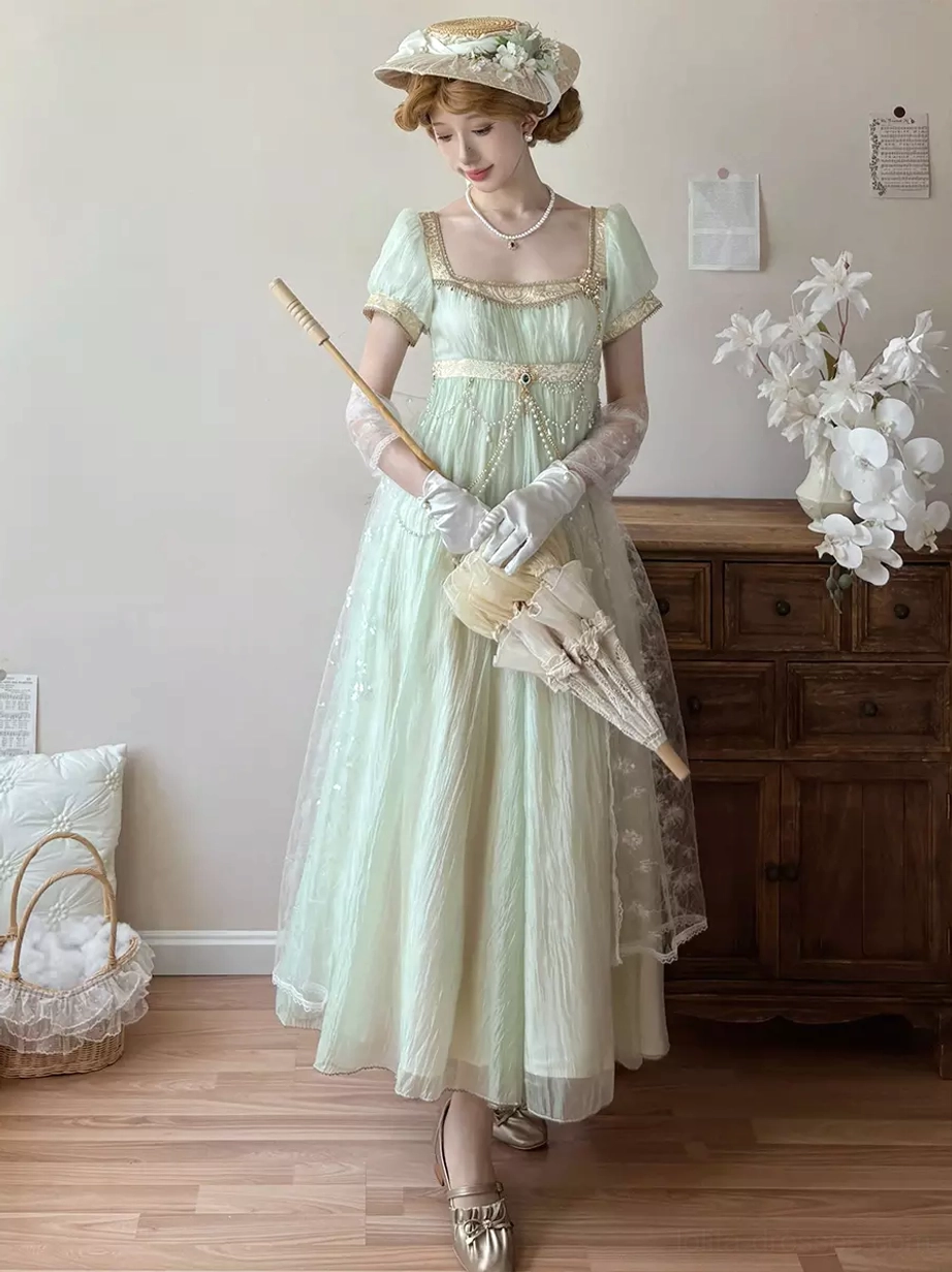 Light gold champagne Regency Lolita evening dress featuring square puff sleeves, empire waist construction, decorative chains, sweet Lolita formal wear