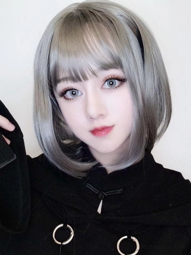 Light gray synthetic lolita wig short bob style with side hairband and straight bangs frontal close-up on model wearing black chinese collar top
