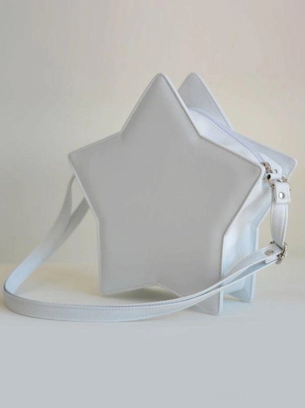 Light gray star-shaped lolita crossbody bag three-quarter side view with metal buckle on shoulder strap clean smooth leather exterior on neutral background