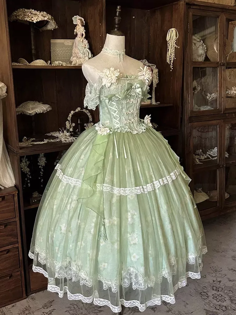 Light green floral off-shoulder lolita dress with layered tulle skirt, vintage glass cabinet shop background, front full view on mannequin