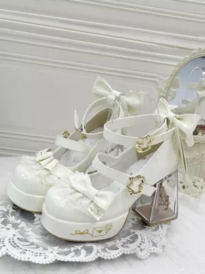 Light green sweet lolita platform pumps with lace trim and bow accents featuring transparent chunky heel, front oblique view on decorative lace tablecloth
