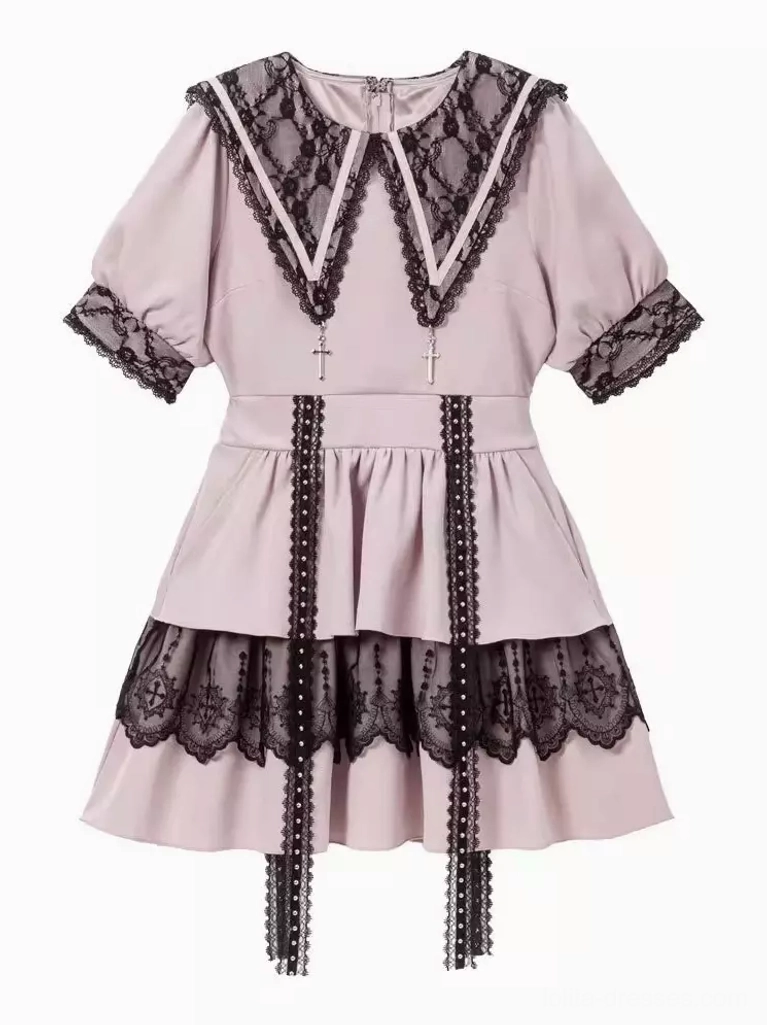 Light pink and black gothic lolita sailor dress front product display featuring layered lace skirt and hanging tassel decorations on white background