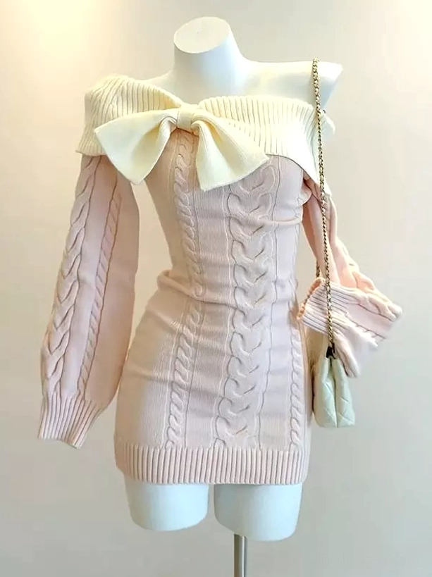 Light pink cable knit off-shoulder sweet lolita bodycon mini dress with cream bow collar and long sleeves front view on mannequin with light cream chain bag