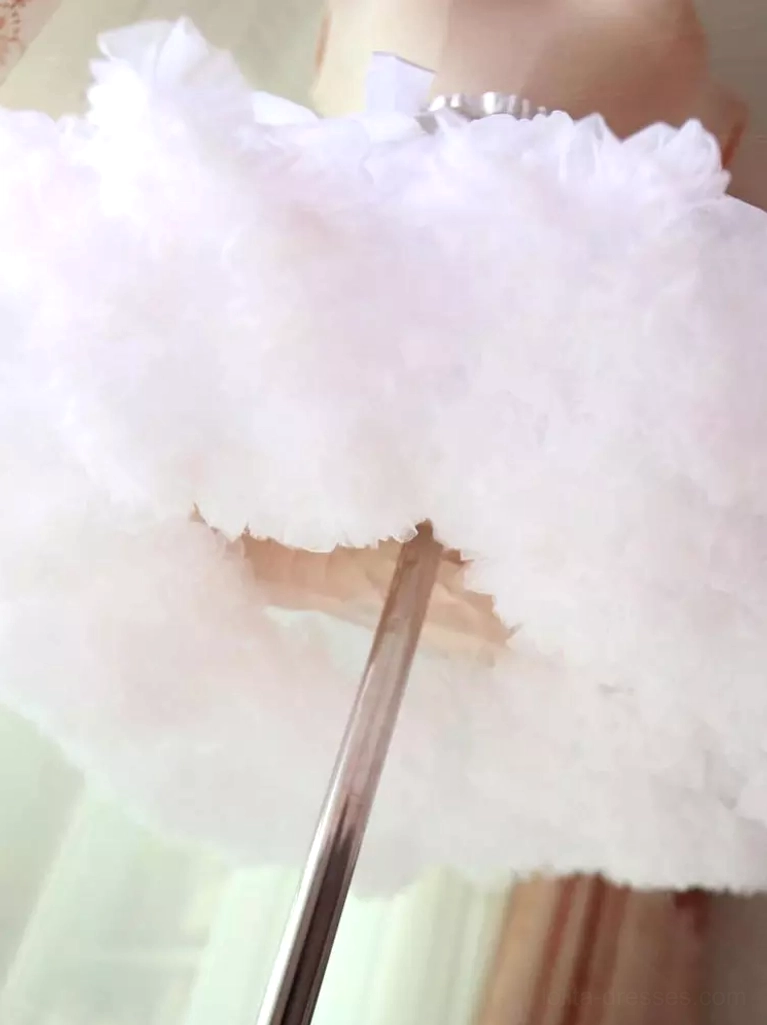 Light pink fluffy lolita petticoat bottom close-up view metal display stand blush pink dense ruffled tulle fabric layers