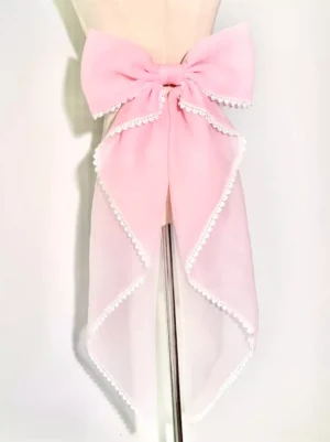 Light pink detachable bow train tail accessory for sweet lolita dress with scalloped lace trim displayed on mannequin front view