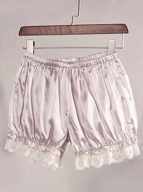 Light gray-purple lolita bloomers hanging on wooden clothes hanger, front view displaying full satin-like fabric drape, elastic waist, and white delicate lace hem trim