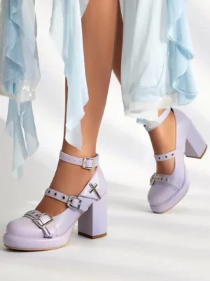 Light purple sweet lolita chunky heel Mary Jane shoes with silver cross buckles and platform sole, worn with light blue chiffon skirt showing side front angle