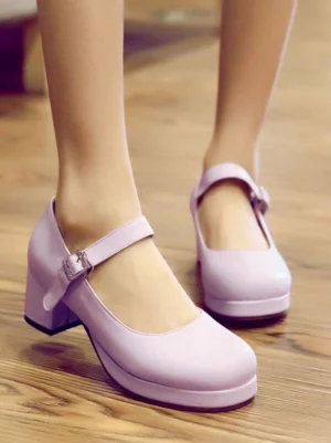 Light purple Sweet Lolita Mary Jane pumps with round toe and ankle buckle strap worn on feet, side and front view on wooden floor showing chunky platform block heel and matte PU finish