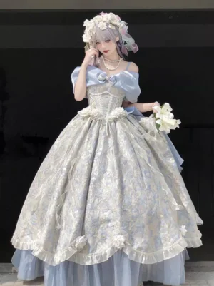 Light sky blue off-shoulder sweet lolita ball gown with floral jacquard fabric and large front bow, worn by female model with flower crown in studio setting, showcasing front full-body princess silhouette