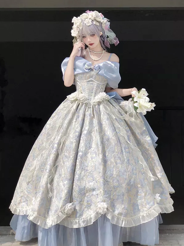 Light sky blue off-shoulder sweet lolita ball gown with floral jacquard fabric and large front bow, worn by female model with flower crown in studio setting, showcasing front full-body princess silhouette