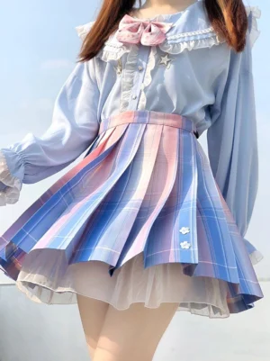 Light sky blue ombre academic lolita pleated skirt front view with tulle lining and A-line silhouette outdoor styling