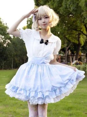 Light sky blue pastoral lolita skirt with delicate floral print and cascading ruffled hem, front full-body view worn with white blouse and black bow collar accent, outdoor park setting