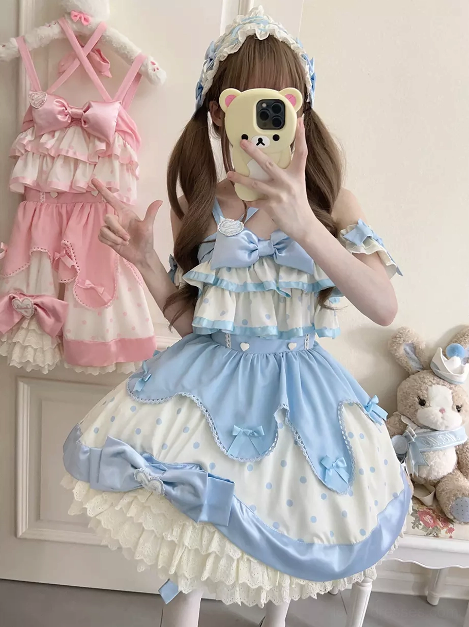 Light sky blue and white polka dot sweet lolita jumper dress with waist satin bow, ruffled skirt hem, modeled with blue hair headband and twin tails