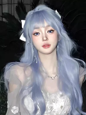 Light sky blue long wavy lolita wig with air bangs and white hair bow, worn with rhinestone necklace and sheer formal dress in night outdoor setting