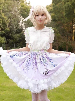 Lilac floral sweet lolita suspender skirt with white ruffled hem front view outdoor on blonde model wearing coordinated lolita outfit with butterfly print details