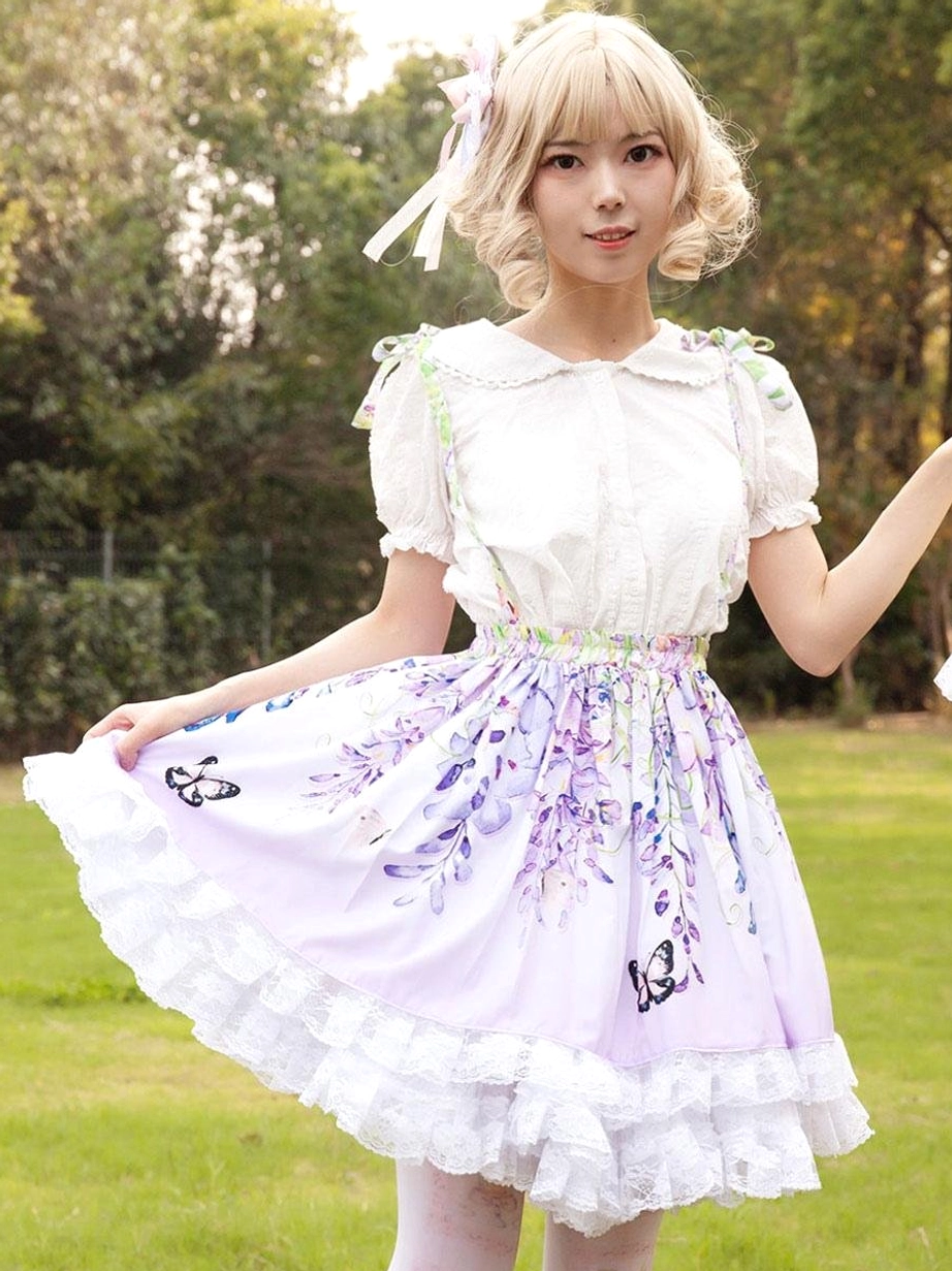 Front low angle shot lilac floral print lolita suspender skirt full print coverage with pink patterned tights model aesthetic styling