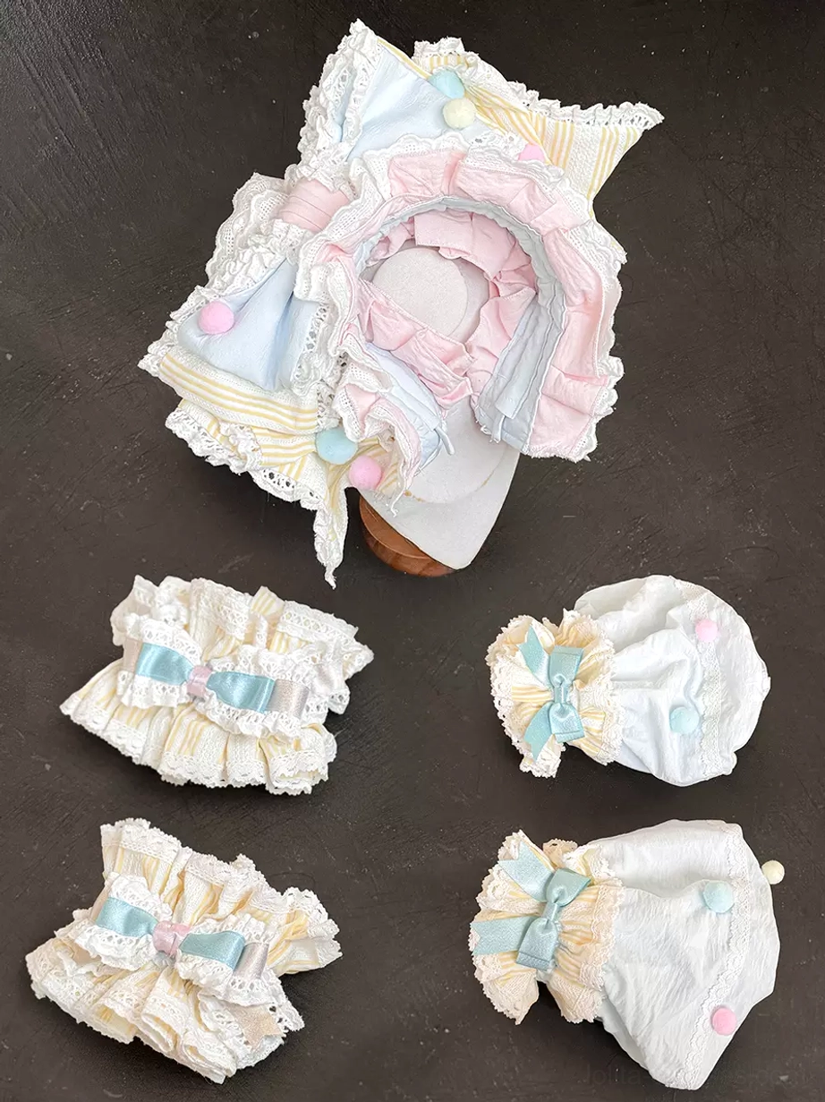 Separated Lolita dress accessories flat lay ruffled bonnet wrist cuffs hair clips lace trims coordinating pieces components detail view