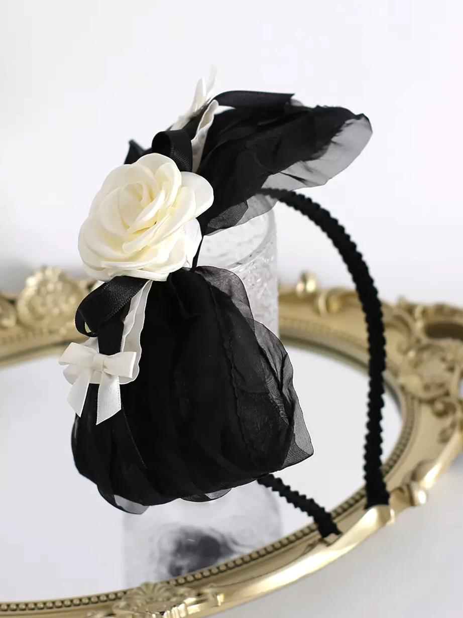 Flat lay product photography of classic Lolita KC hair hoop headdress on golden vintage mirror tray, displaying textured black headband, complete floral and mesh decorations from top view