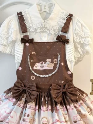 Close-up front view of dessert bear print lolita pinafore dress showing detailed bear motifs, waist bow decorations, polka dot bodice pattern, and lace trim accents