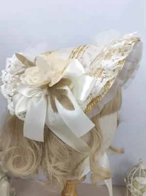 Cream floral lolita bonnet with ivory satin bow and delicate lace ruffles - side oblique view on blonde mannequin