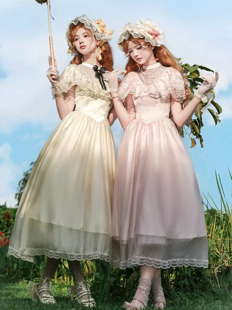 Lolita headdress worn with lace-trimmed vintage dress and parasol, front view of pastoral Sweet Lolita aesthetic in garden setting