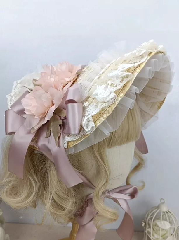 Sweet lolita bonnet with pink floral decor, mauve satin bow, and ruffled lace accents - side view on blonde wig
