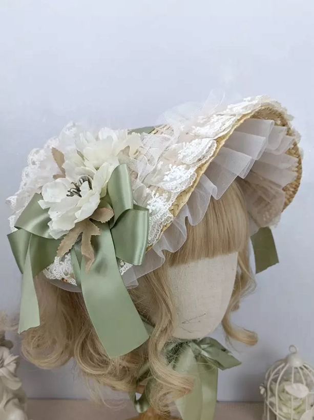 Sage green satin bow lolita bonnet with white anemone and lace trim - side oblique view on mannequin