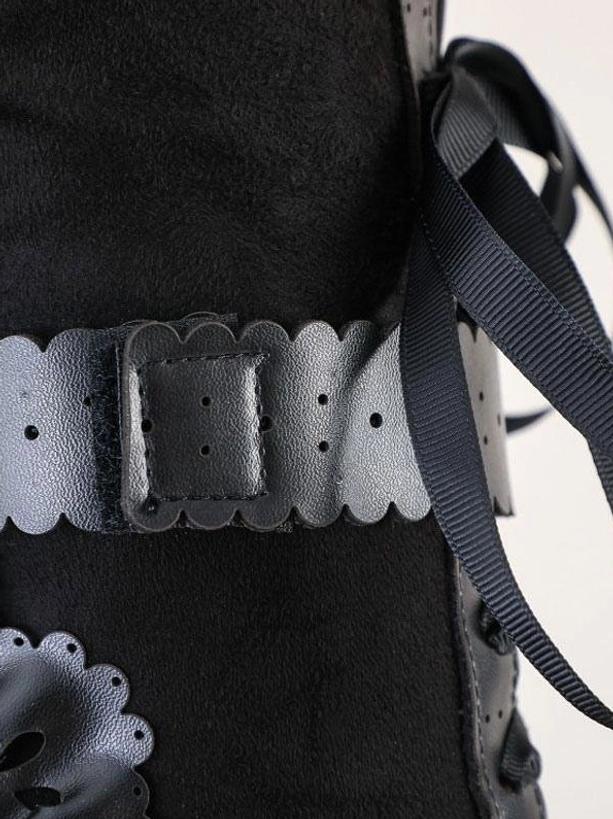 Lolita boot close-up detail showing scalloped leather trim ribbon laces suede fabric and buckle strap