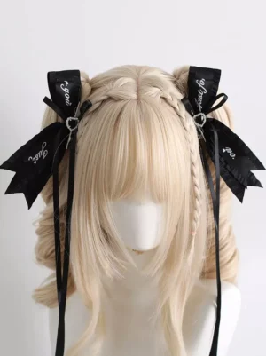 black bow lolita hair clips front view with script print decoration long ribbon tassels and rhinestone gems on braided blonde wig