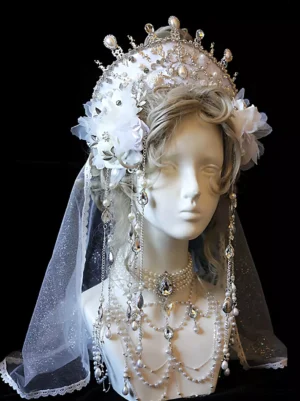 Elegant bridal crown lolita accessory left oblique angle showing silver diamond crown, fabric flower embellishments, hanging crystal bead chains, shimmer tulle veil, and coordinating pearl choker