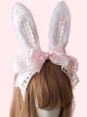 Lolita hair accessory bunny ear clasp with light pink satin bow and white lace edging on mannequin wearing brown wig, displaying pure white grid inner fabric and soft plush ears on solid light pink background
